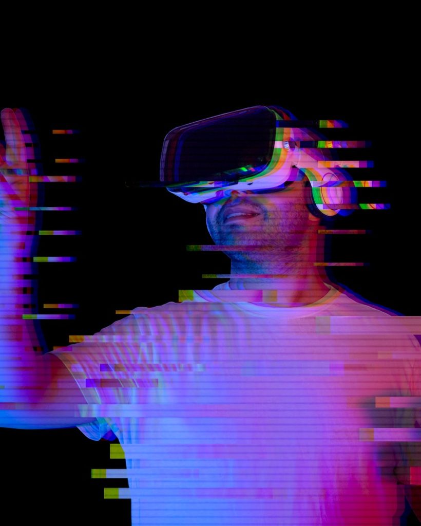 young-man-using-vr-glasses-with-glitch-effect-new-virtual-world-metaverse.jpg